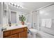 Updated bathroom with sleek fixtures and a bathtub with shower doors at 3335 S Ammons St # 6-102, Lakewood, CO 80227