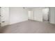 Spacious bedroom with neutral carpet, attached bath, and closet for ample storage at 3335 S Ammons St # 6-102, Lakewood, CO 80227