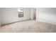 Inviting bedroom featuring neutral carpet and a view from the window at 3335 S Ammons St # 6-102, Lakewood, CO 80227