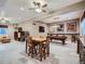 Large basement with a billiards table, dining area, and lounge area, designed for entertainment and relaxation at 5590 W 97Th Ave, Westminster, CO 80020