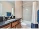 Bathroom with modern fixtures, granite countertops, and tiled shower/tub combination at 5590 W 97Th Ave, Westminster, CO 80020
