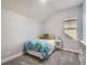 Cozy bedroom with a vaulted ceiling, bright window, and comfortable queen-sized bed and a light and airy atmosphere at 5590 W 97Th Ave, Westminster, CO 80020