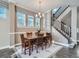 Charming dining room with a wooden table, comfortable chairs, and natural light from the window at 5590 W 97Th Ave, Westminster, CO 80020