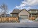 Charming home exterior with fenced yard, mature trees, and two car garage at 5590 W 97Th Ave, Westminster, CO 80020