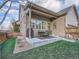 Outdoor patio with grill, dining set, and manicured lawn at 5590 W 97Th Ave, Westminster, CO 80020