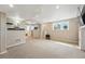 Finished basement with neutral walls and carpet at 12996 Banyon Cir, Parker, CO 80134