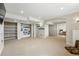 This basement has carpet, an arched doorway, recessed lighting, shelving, and an opening to a bedroom at 12996 Banyon Cir, Parker, CO 80134
