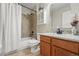 Bathroom with a shower-tub combo and vanity with granite countertop at 12996 Banyon Cir, Parker, CO 80134