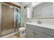 Modern bathroom with glass shower, vanity, and stylish fixtures at 12996 Banyon Cir, Parker, CO 80134