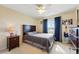 Cozy bedroom with window and dark wood accents at 12996 Banyon Cir, Parker, CO 80134