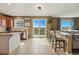 Open concept kitchen and bar seating area with views of the valley at 12996 Banyon Cir, Parker, CO 80134