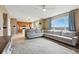 Bright and open living room with scenic views, comfortable seating, and hardwood floors at 12996 Banyon Cir, Parker, CO 80134
