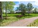 Scenic park view with a picnic table and lush greenery, perfect for outdoor relaxation and enjoyment at 12996 Banyon Cir, Parker, CO 80134