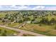 Aerial view of a home with a multi-car garage, on a large lot in a picturesque neighborhood at 3672 Deer Creek Dr, Parker, CO 80138