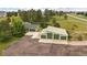 Aerial view highlighting the home's large driveway and oversized garage at 3672 Deer Creek Dr, Parker, CO 80138