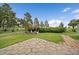 Landscaped backyard with gazebo and stone patio at 3672 Deer Creek Dr, Parker, CO 80138