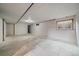 Basement featuring a window for natural light and concrete floor at 3672 Deer Creek Dr, Parker, CO 80138