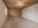 Bedroom features neutral carpet, a ceiling fan, and a sliding closet at 3672 Deer Creek Dr, Parker, CO 80138