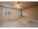 Primary bedroom with two windows for natural light and a ceiling fan at 3672 Deer Creek Dr, Parker, CO 80138