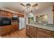 Open kitchen with granite countertops, wood floors, and stainless steel appliances at 3672 Deer Creek Dr, Parker, CO 80138