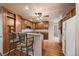 Bright kitchen boasts wooden cabinets, granite countertops, and stainless steel appliances at 3672 Deer Creek Dr, Parker, CO 80138