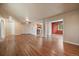 Expansive living room with hardwood floors and ample space for entertaining at 3672 Deer Creek Dr, Parker, CO 80138