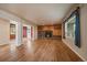 Cozy living room with a fireplace and well-maintained hardwood floors at 3672 Deer Creek Dr, Parker, CO 80138