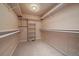 Walk-in closet featuring carpet floors, organizers, and storage shelves at 3672 Deer Creek Dr, Parker, CO 80138
