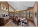Formal dining room featuring ample natural light, creating a warm and inviting atmosphere for gatherings at 9 Red Fox Ln, Littleton, CO 80127