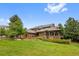 Beautiful home with mature landscaping and private backyard, creating a serene and inviting outdoor space at 9 Red Fox Ln, Littleton, CO 80127