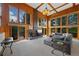 Inviting living room with grand fireplace and floor-to-ceiling windows showcasing scenic outdoor views at 9 Red Fox Ln, Littleton, CO 80127