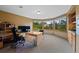 Office space featuring a large bay window, neutral colored walls, and a work area at 9 Red Fox Ln, Littleton, CO 80127