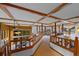 An upper-level landing shows the coffered ceiling and views of other levels of the home at 9 Red Fox Ln, Littleton, CO 80127