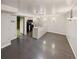 Finished basement with dark wood floors and small kitchen area at 10951 Rosalie Dr, Northglenn, CO 80233