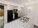 Finished basement kitchen with stainless steel appliances, granite countertops, and ample lighting at 10951 Rosalie Dr, Northglenn, CO 80233