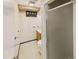 Compact basement bathroom with shower, toilet, sink, and built-in storage at 10951 Rosalie Dr, Northglenn, CO 80233