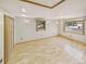 A bright bedroom with two windows and hardwood floors at 10951 Rosalie Dr, Northglenn, CO 80233