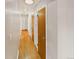 Long hallway showcasing wood floors and leading to various rooms in the home at 10951 Rosalie Dr, Northglenn, CO 80233