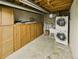 Basement laundry room featuring washer, dryer, utility sink, and plenty of storage at 10951 Rosalie Dr, Northglenn, CO 80233