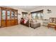 Inviting bedroom with a decorative cabinet, scenic views, and comfortable seating at 11033 Barker Ave, Conifer, CO 80433