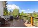 Relaxing deck space with comfortable seating around a fire pit, offering tranquil views of the surrounding greenery at 11033 Barker Ave, Conifer, CO 80433