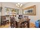 Comfortable dining room with wood table and view of the exterior at 11033 Barker Ave, Conifer, CO 80433