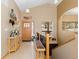 Inviting foyer with wood accents, tile flooring, and view of staircase at 11033 Barker Ave, Conifer, CO 80433