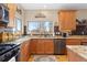 Updated kitchen features granite counters, stainless appliances, custom backsplash and views of the mountains at 11033 Barker Ave, Conifer, CO 80433