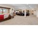 Spacious living room features a fireplace, carpeted floors and a large window with natural light at 11033 Barker Ave, Conifer, CO 80433