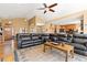Open concept living room featuring hardwood floors, and comfortable leather seating at 11033 Barker Ave, Conifer, CO 80433