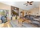 Spacious living room with vaulted ceilings, wood floors, stone accent wall and wood burning stove at 11033 Barker Ave, Conifer, CO 80433