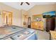 Large main bedroom is complete with dresser, nightstand, and an ensuite bathroom at 11033 Barker Ave, Conifer, CO 80433