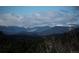 Scenic mountain views of snow-capped peaks from the property at 11033 Barker Ave, Conifer, CO 80433