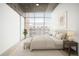 Cozy bedroom with a modern design, ceiling fan, natural light, and neutral color palette at 1700 Bassett St # 703, Denver, CO 80202